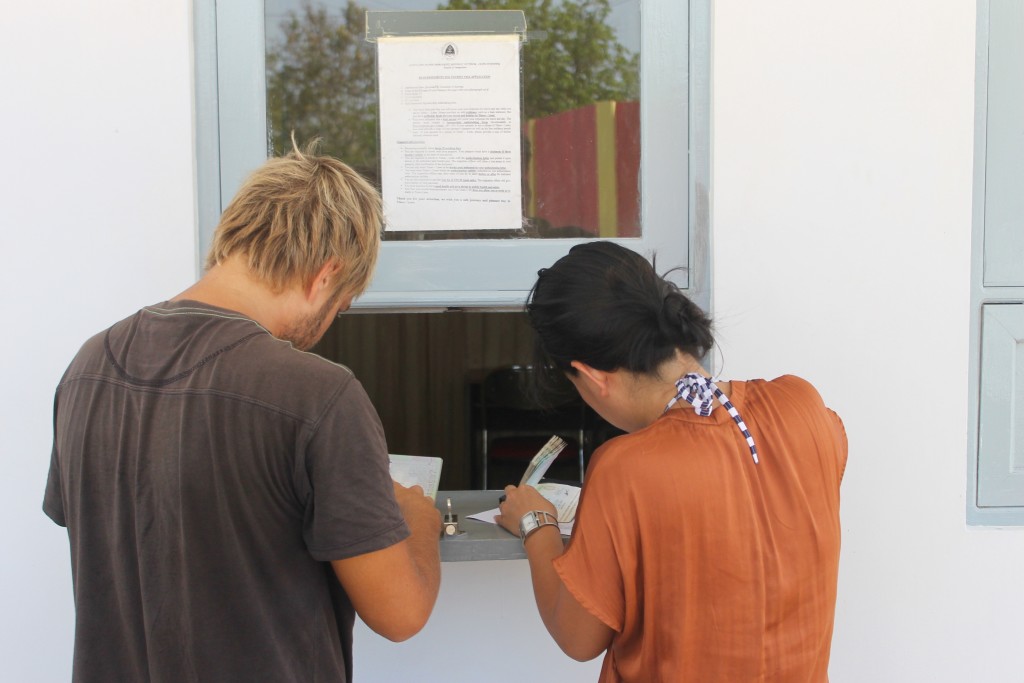 Filling out application at East Timor Consulate