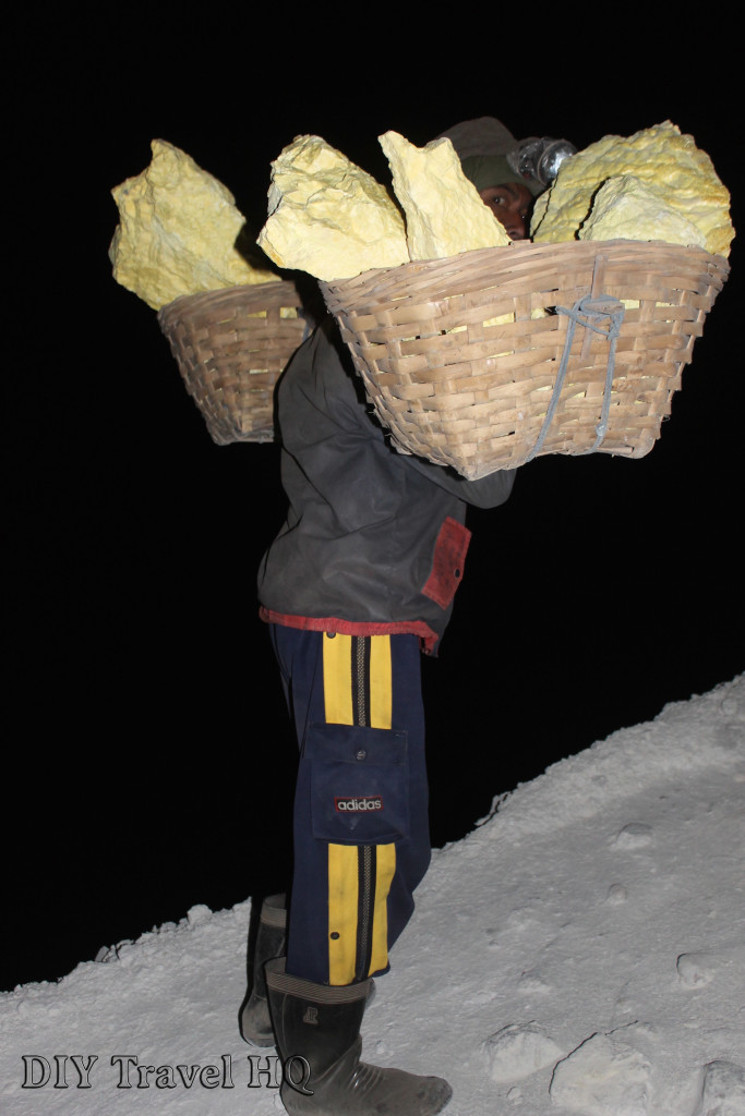 Passing a miner on the night trek up Mt Ijen