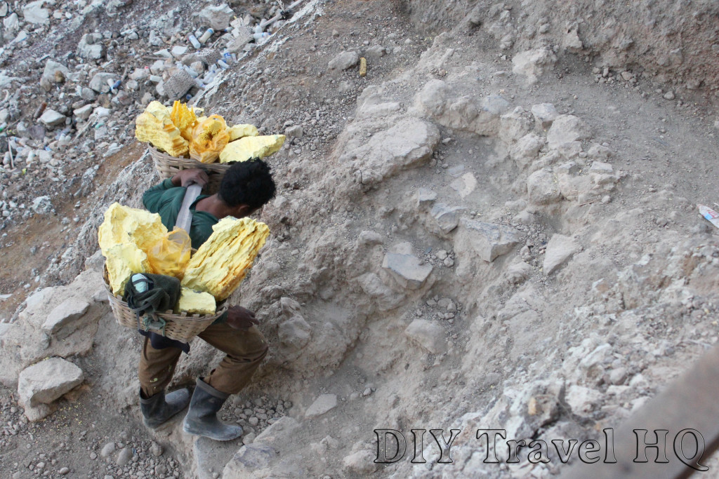 Miner carrying baskets of sulphur on Mt Ijen