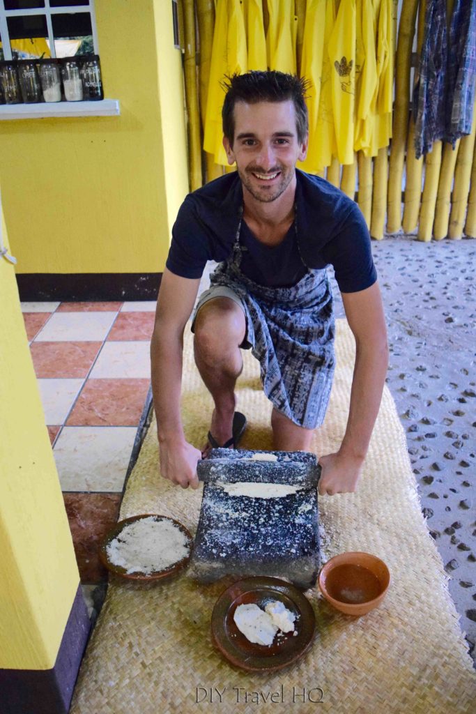 Erik using traditional stone grinder
