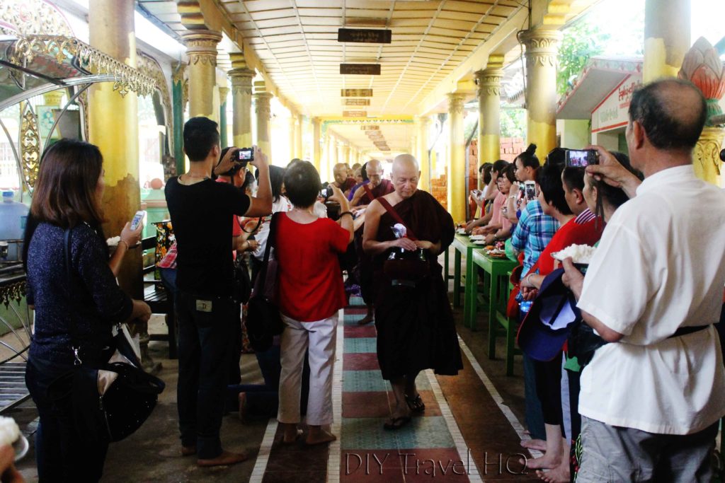 Tourists taking photos of Monk lunch