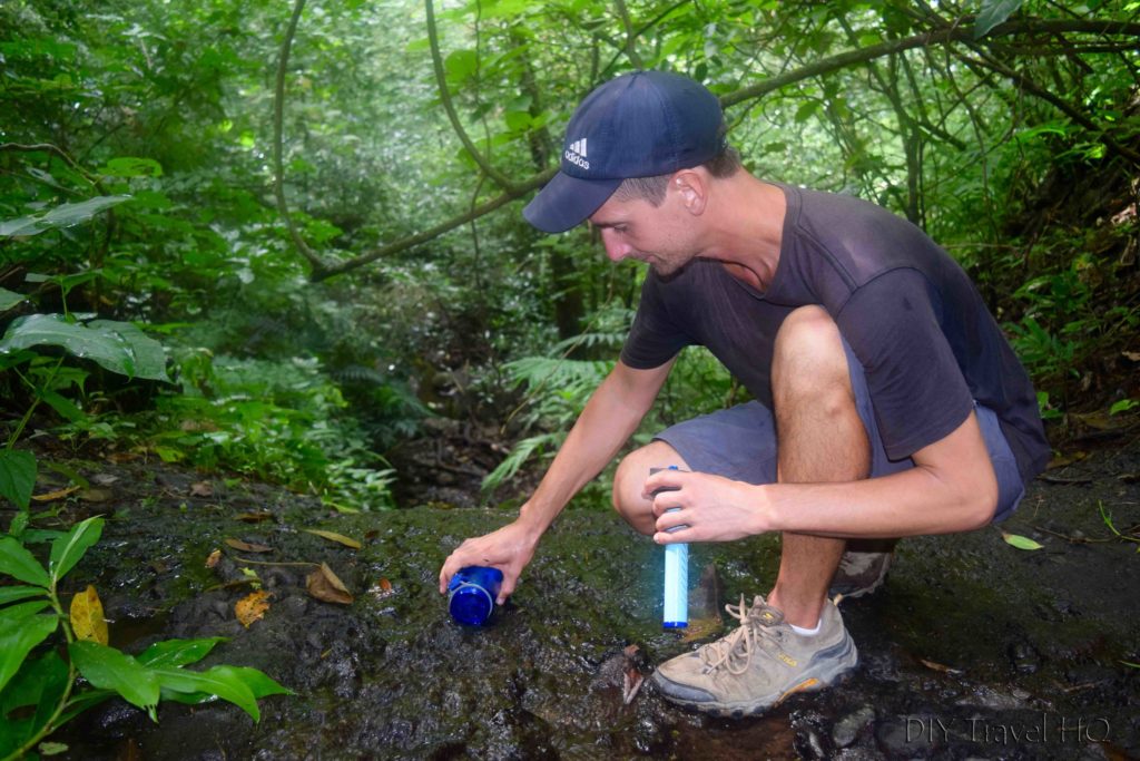 El Imposible National Park Filling LifeStraw with Stream Water