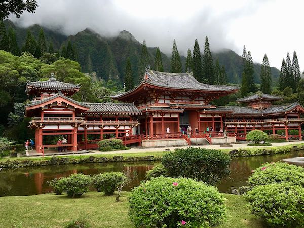 Red Japanese Byodo-In Temples surrounded by mountains and trees - Things to do in Oahi