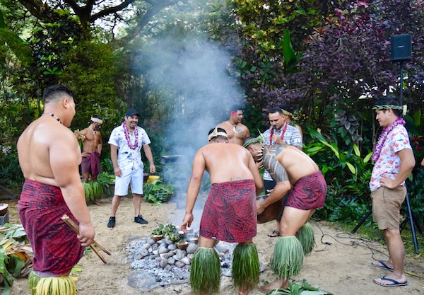 Men around a Luau cookout in Oahu itinerary
